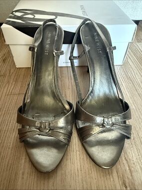 Nine West Metallic Silver Slingback Heels
Size 8.5.